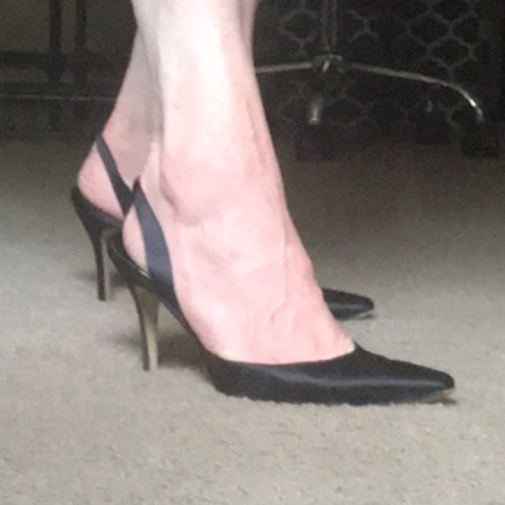 Manolo Blahnik black slingback heels.